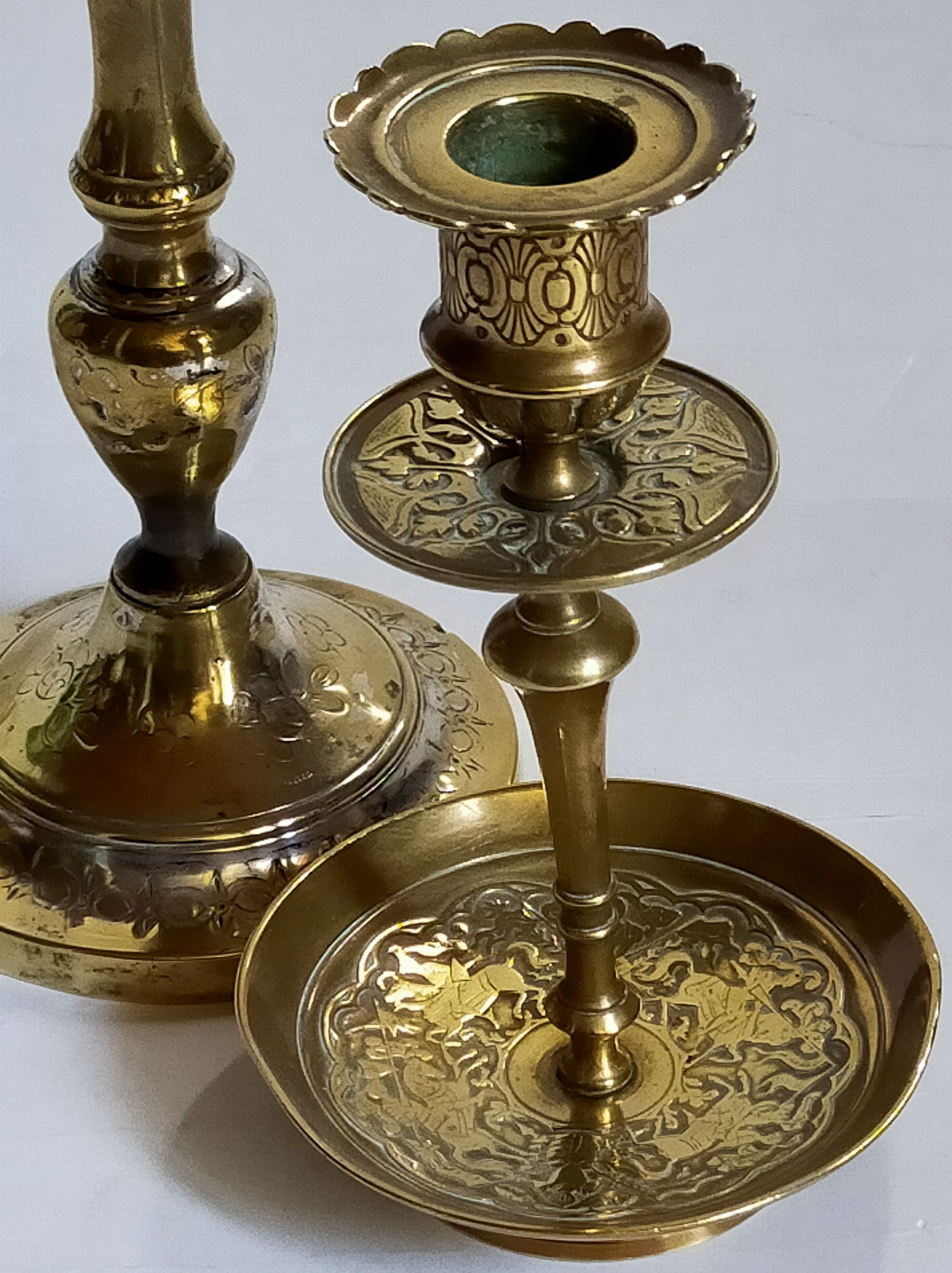 Duo of solid brass and gold metal candle holders worked old