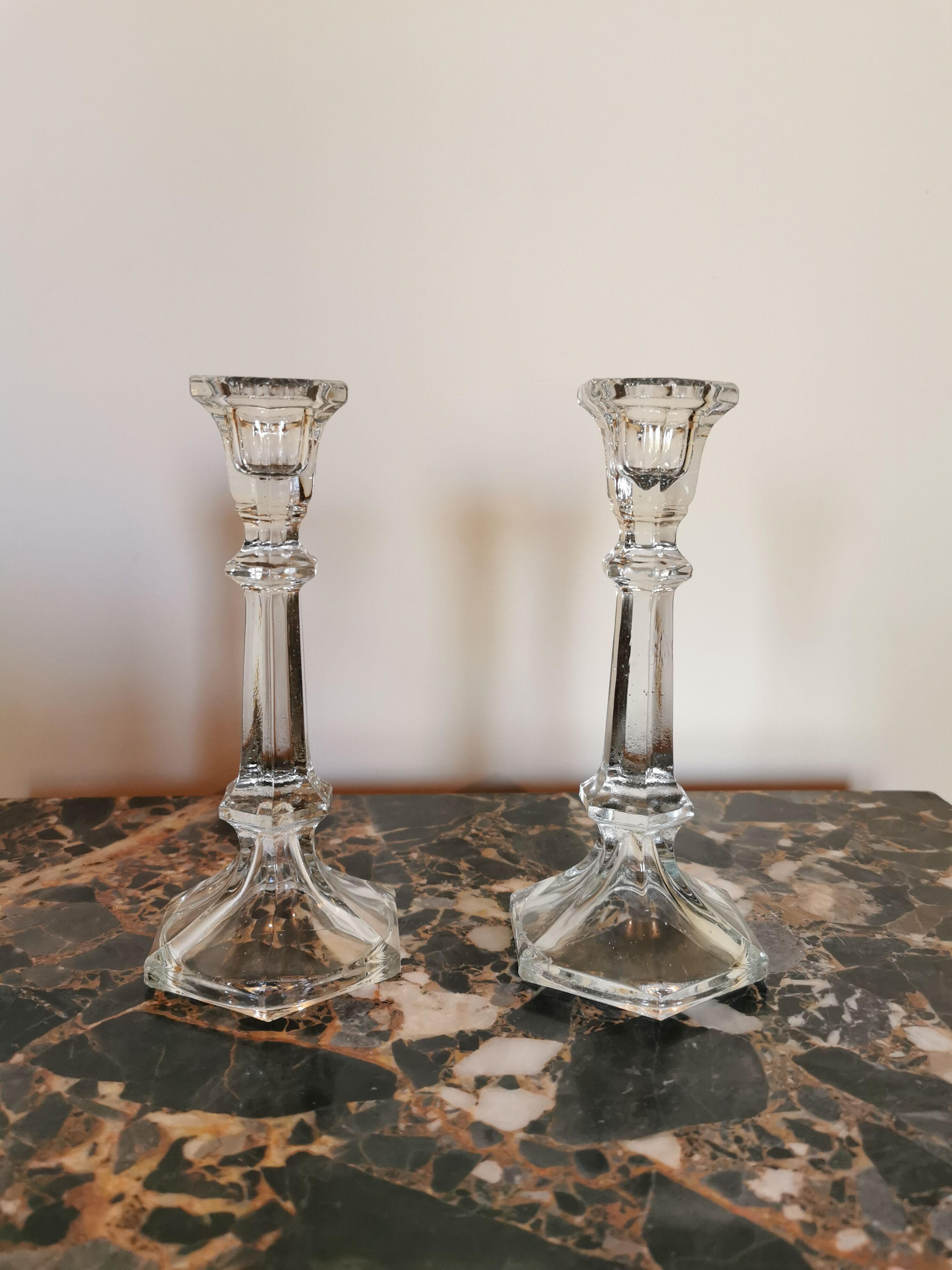 Pair of antique candle holders in transparent glass