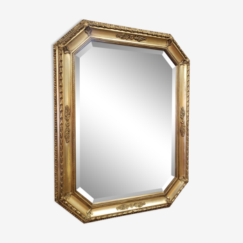 Octagonal mirror in gilded wood