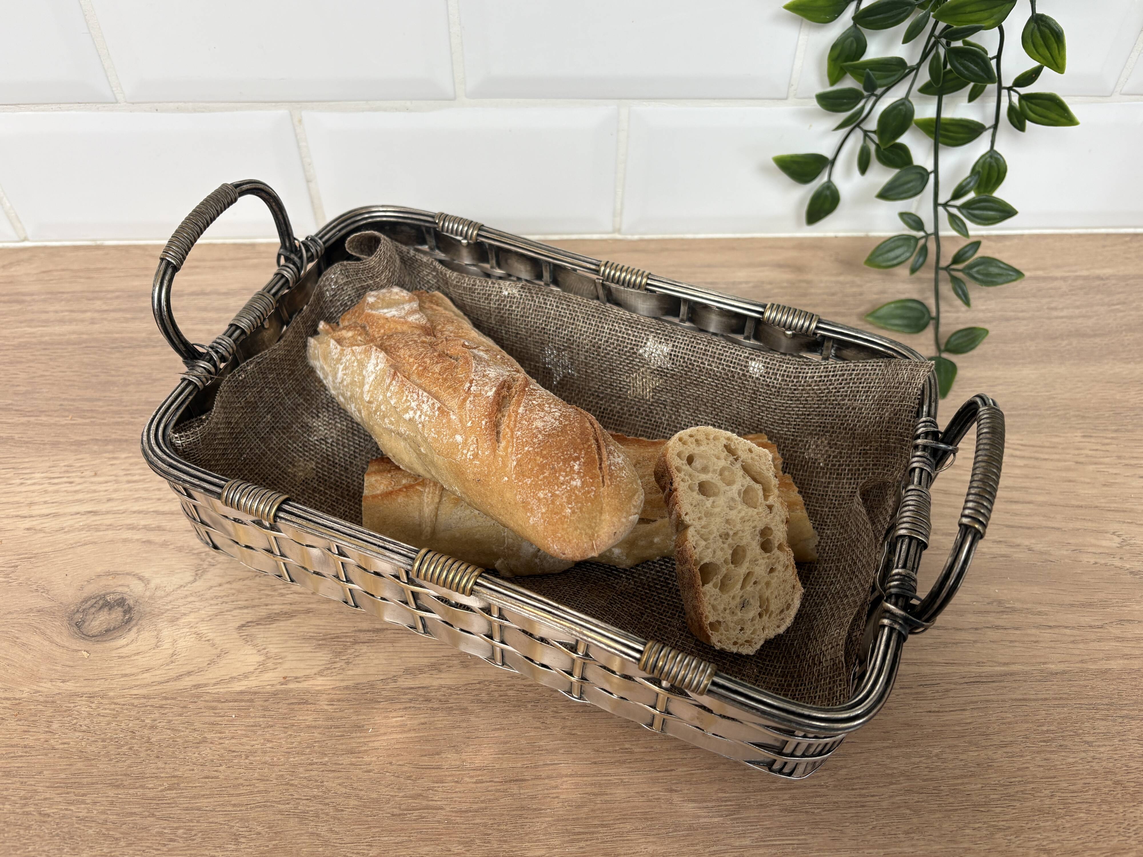 Woven silver-plated metal basket.