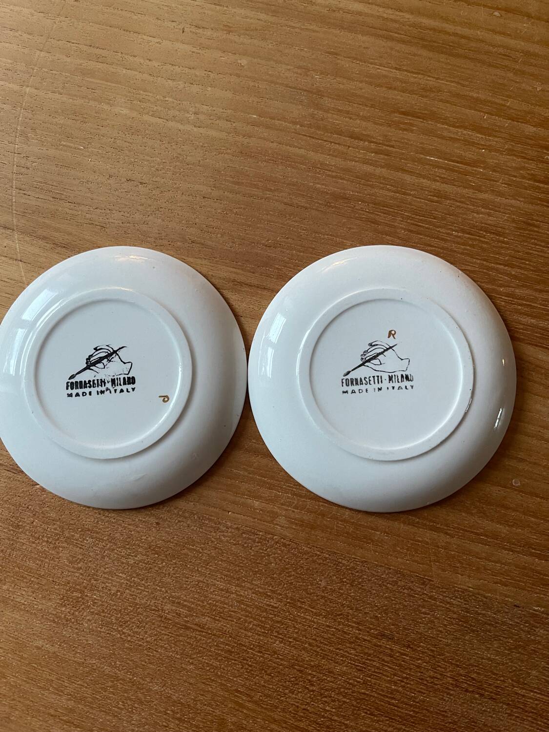 Small Fornasetti plates