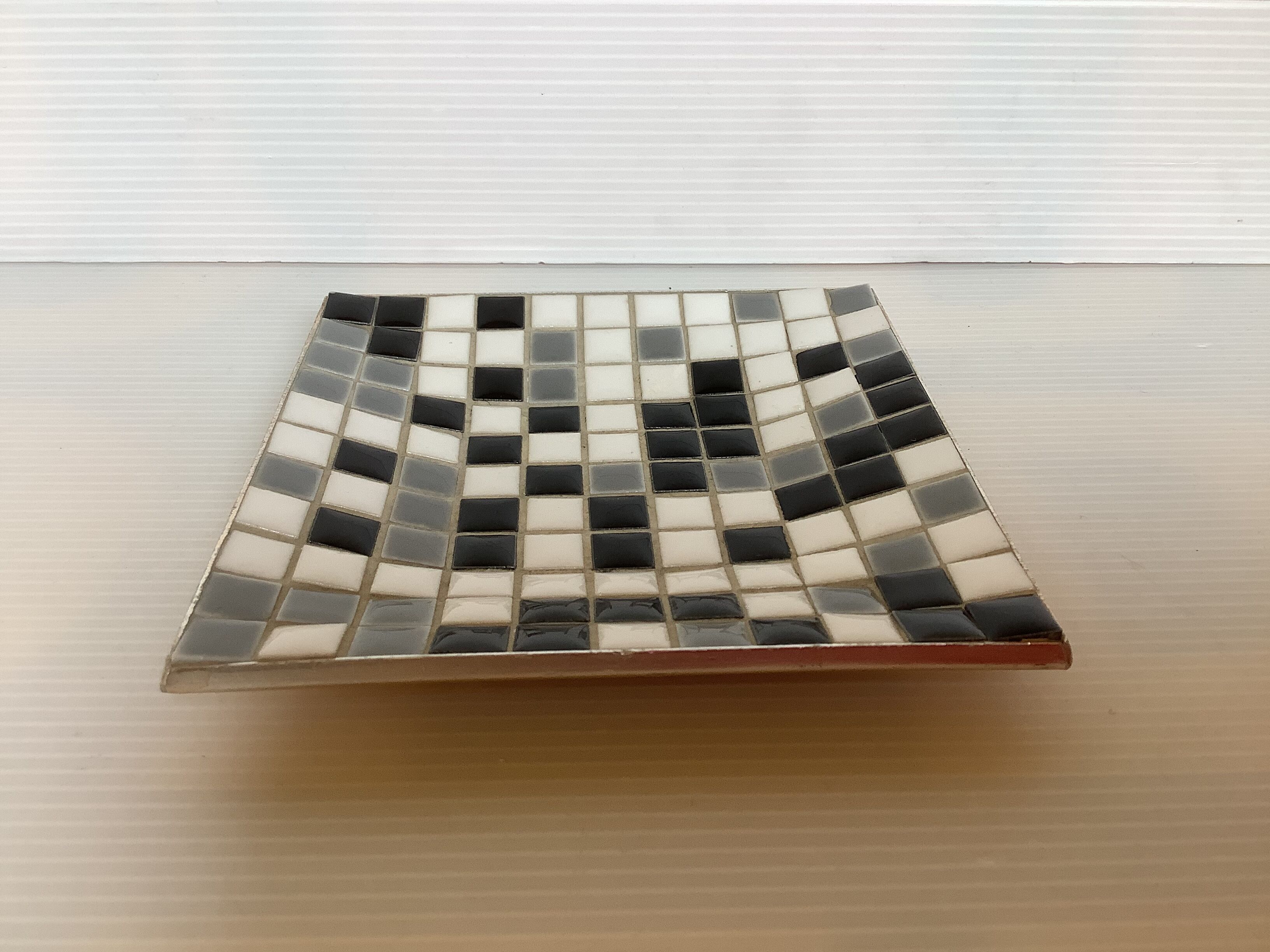 Mosaic grey, white, and black catch-all tray.