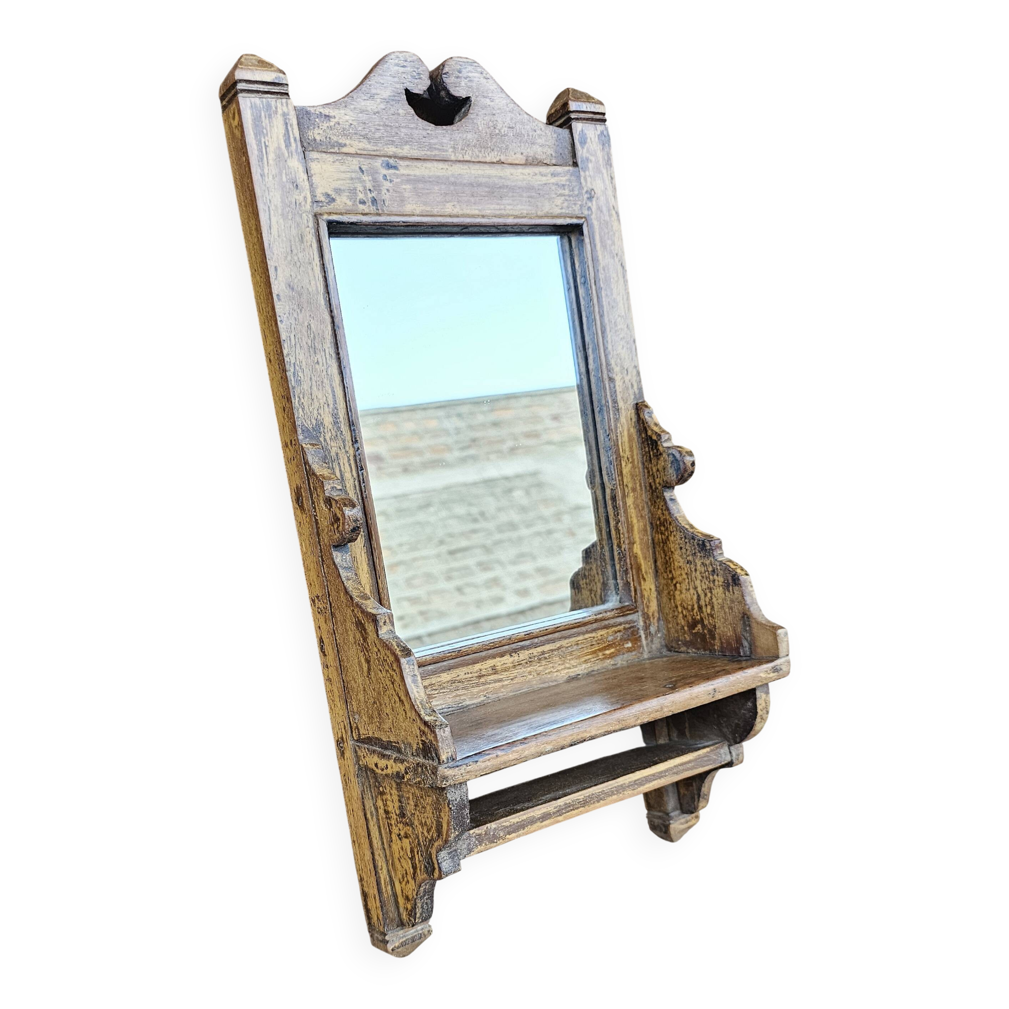Antique barber's mirror in Burmese teak.