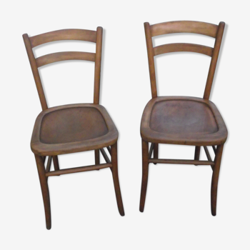 A pair of Lutherma bistro chairs