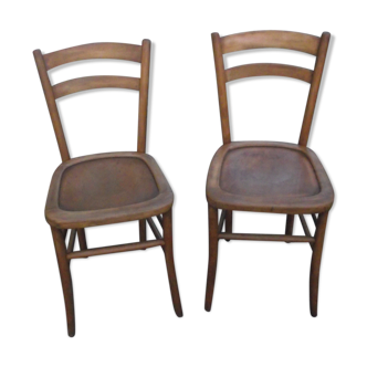 A pair of Lutherma bistro chairs