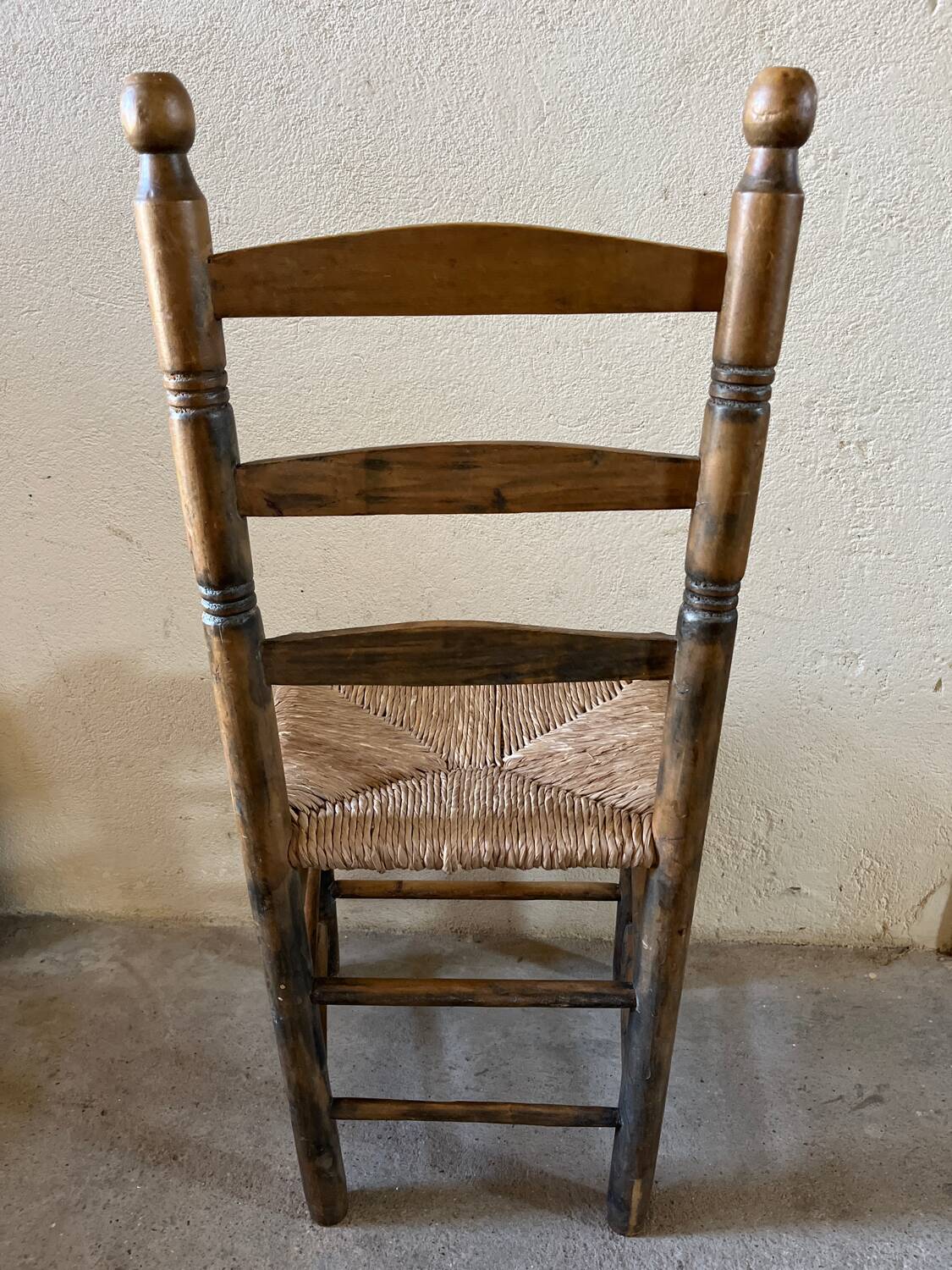 Old turned and stuffed wooden chair