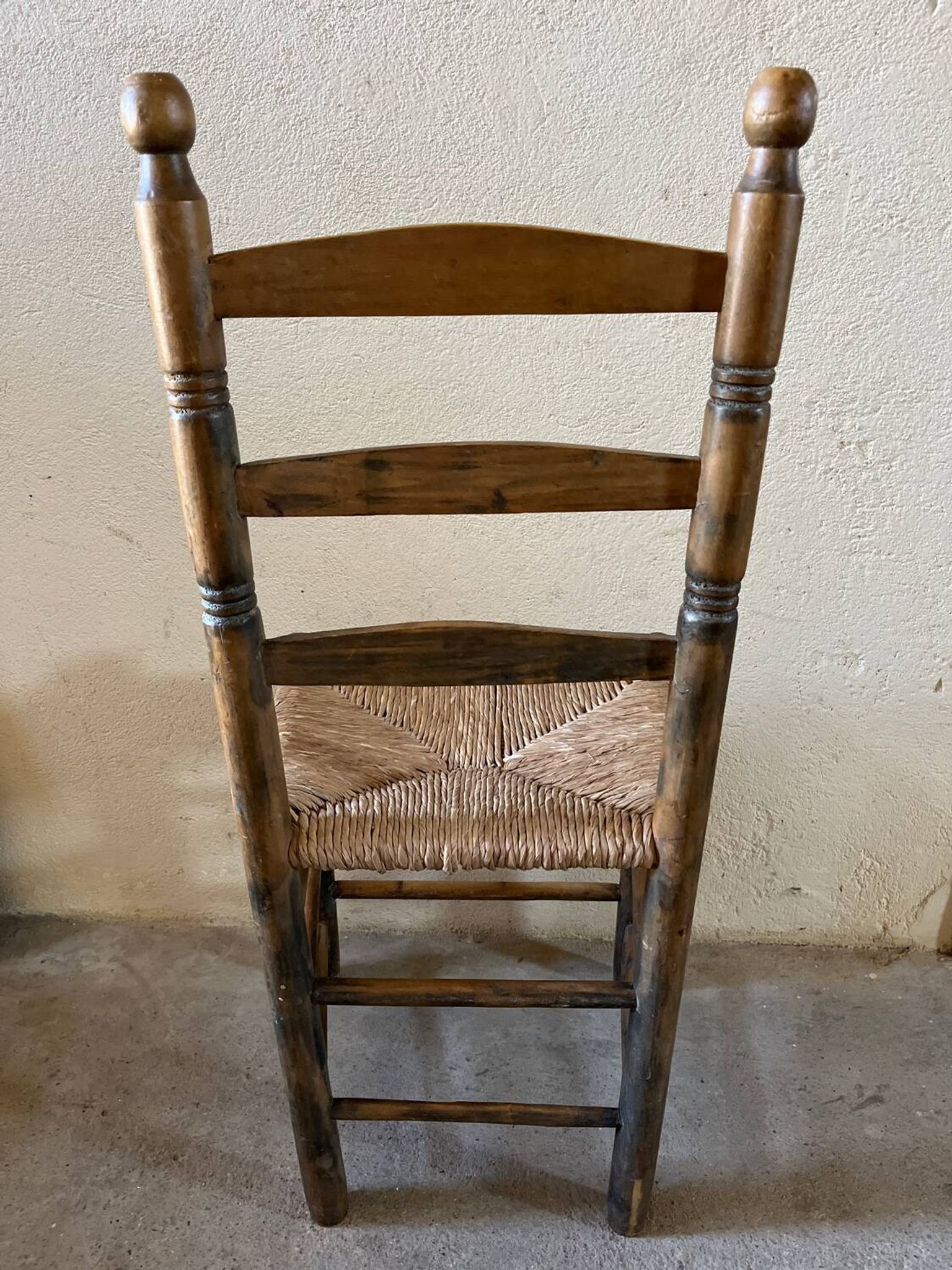 Old turned and stuffed wooden chair