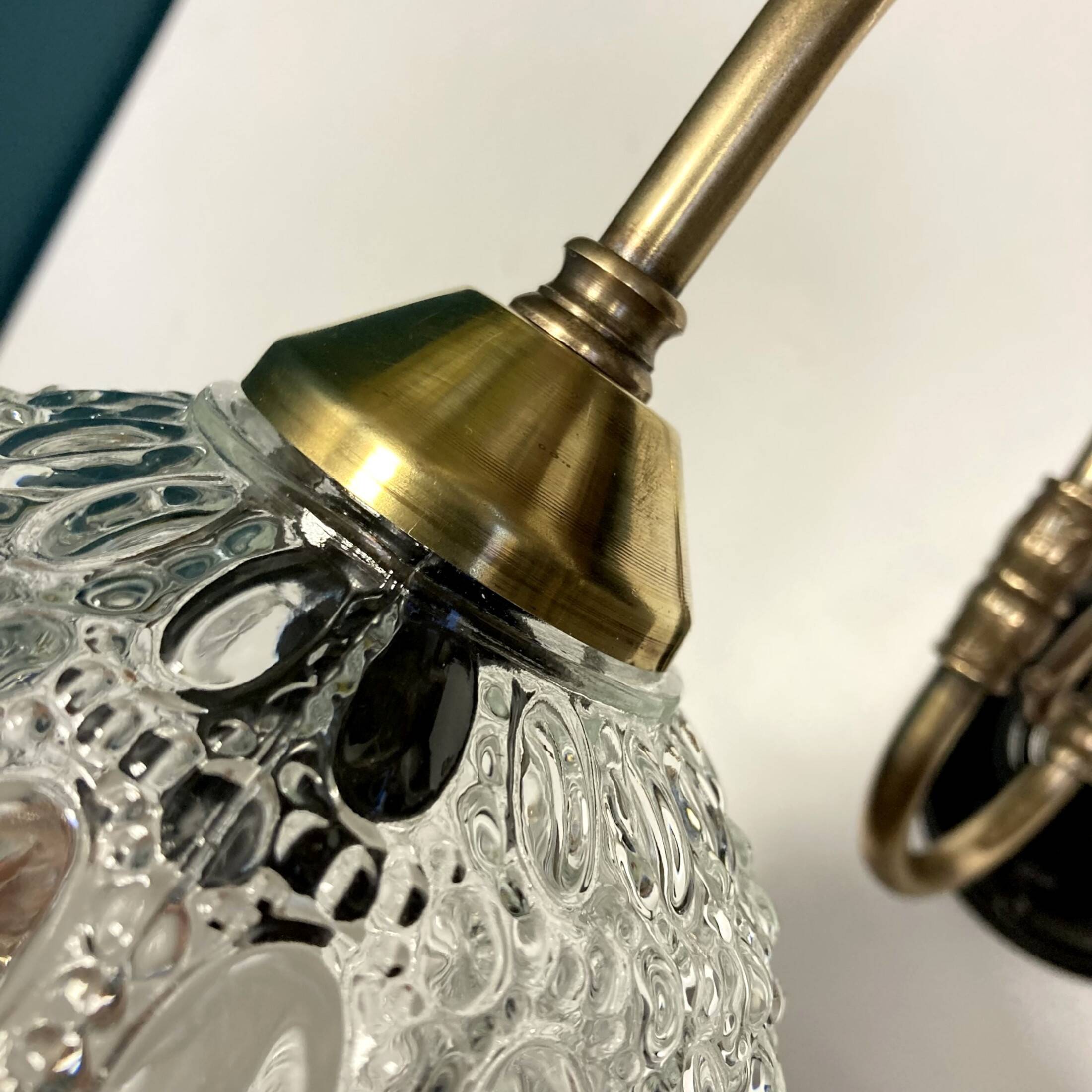 Pair of old swan neck wall lights in brass and transparent glass globe