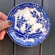Small vintage plates made in Japan in blue and white porcelain.