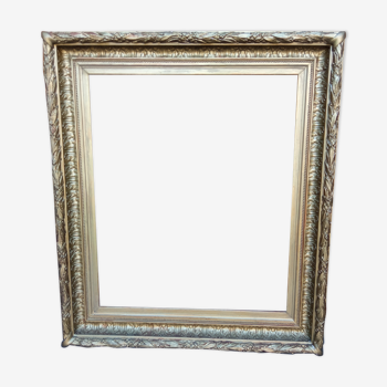 Wooden frame and gilded stuccoes