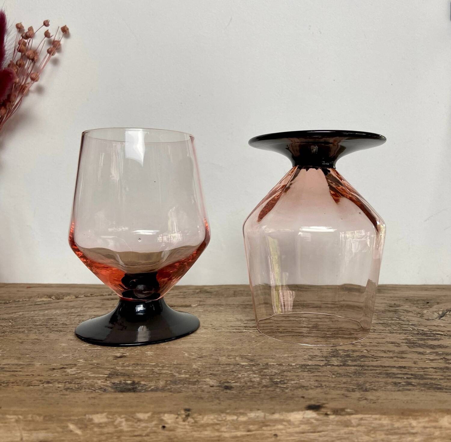 4 pink glasses with black stem