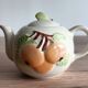 Slush teapot with embossed fruit decoration