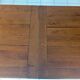 Large rectangular dining table in solid oak in a neo-rustic style.