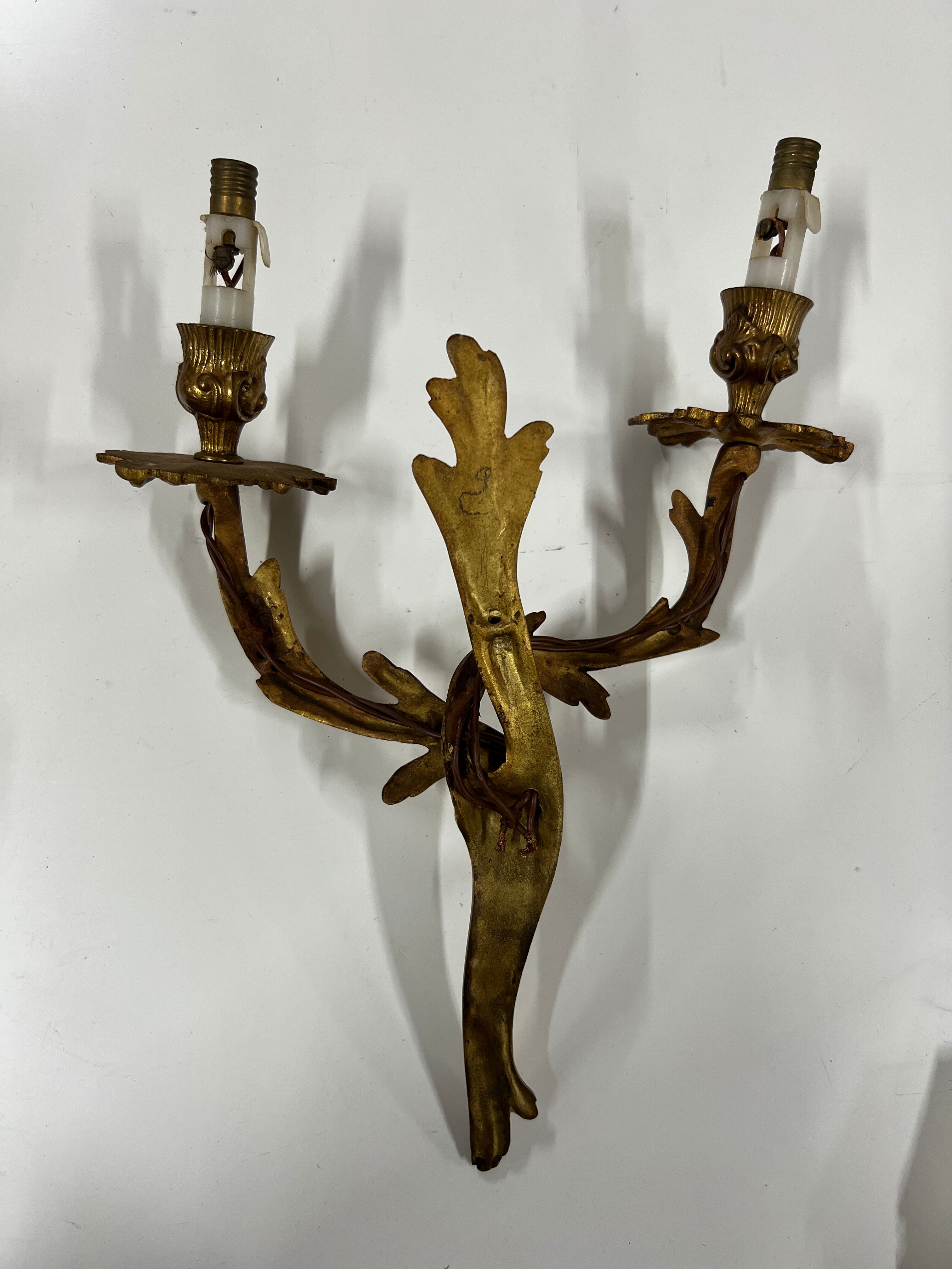 Pair of Louis XV wall lamps in gilded bronze