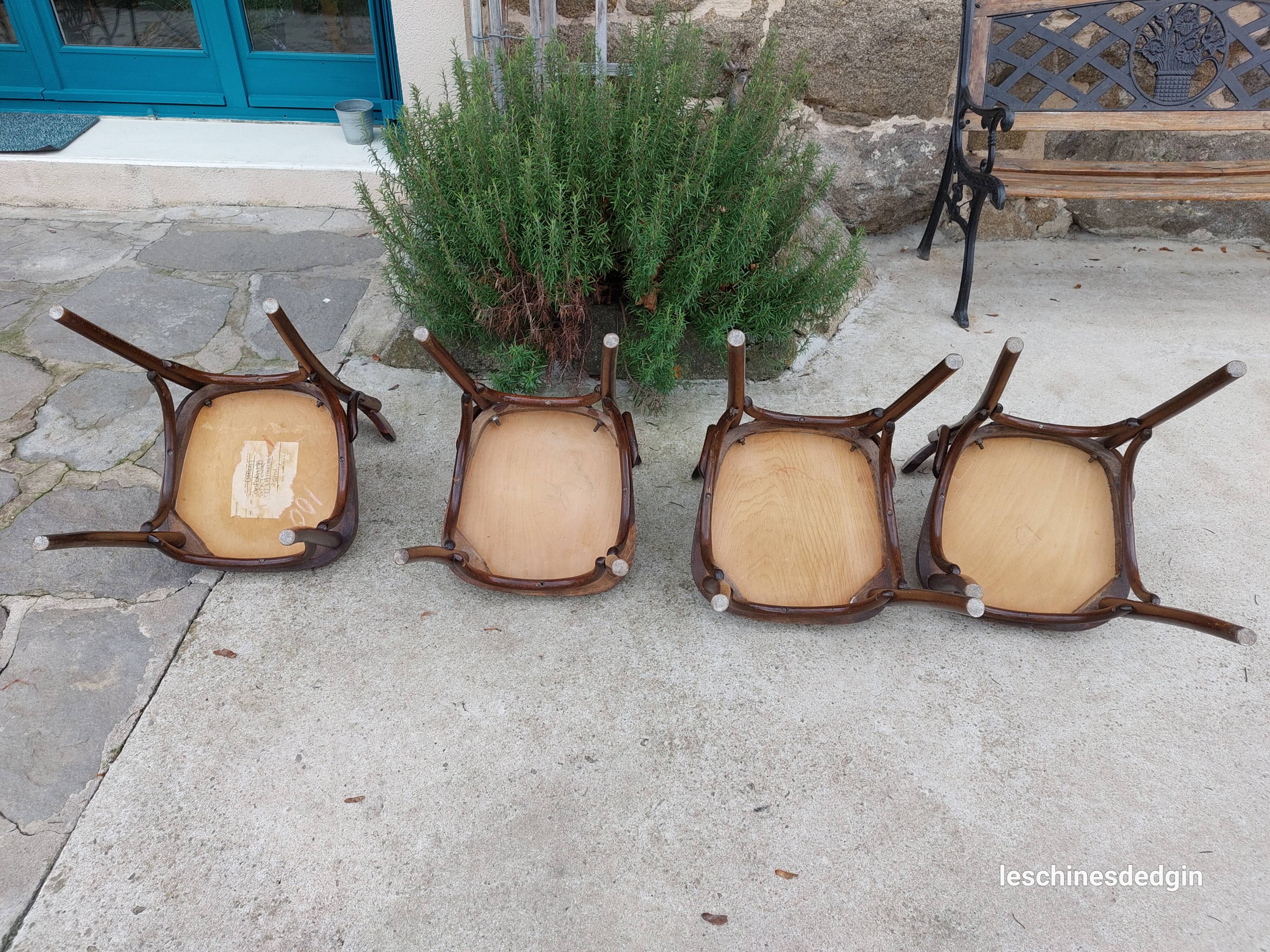 4 bentwood bistro chairs with a pattern on the seat