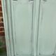 Cloakroom with sage green wall coats