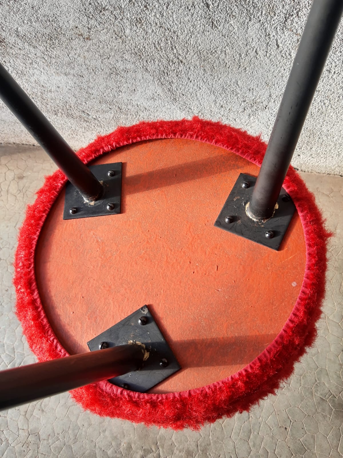 Tripod stool with vintage red moumoute seat