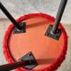Tripod stool with vintage red moumoute seat