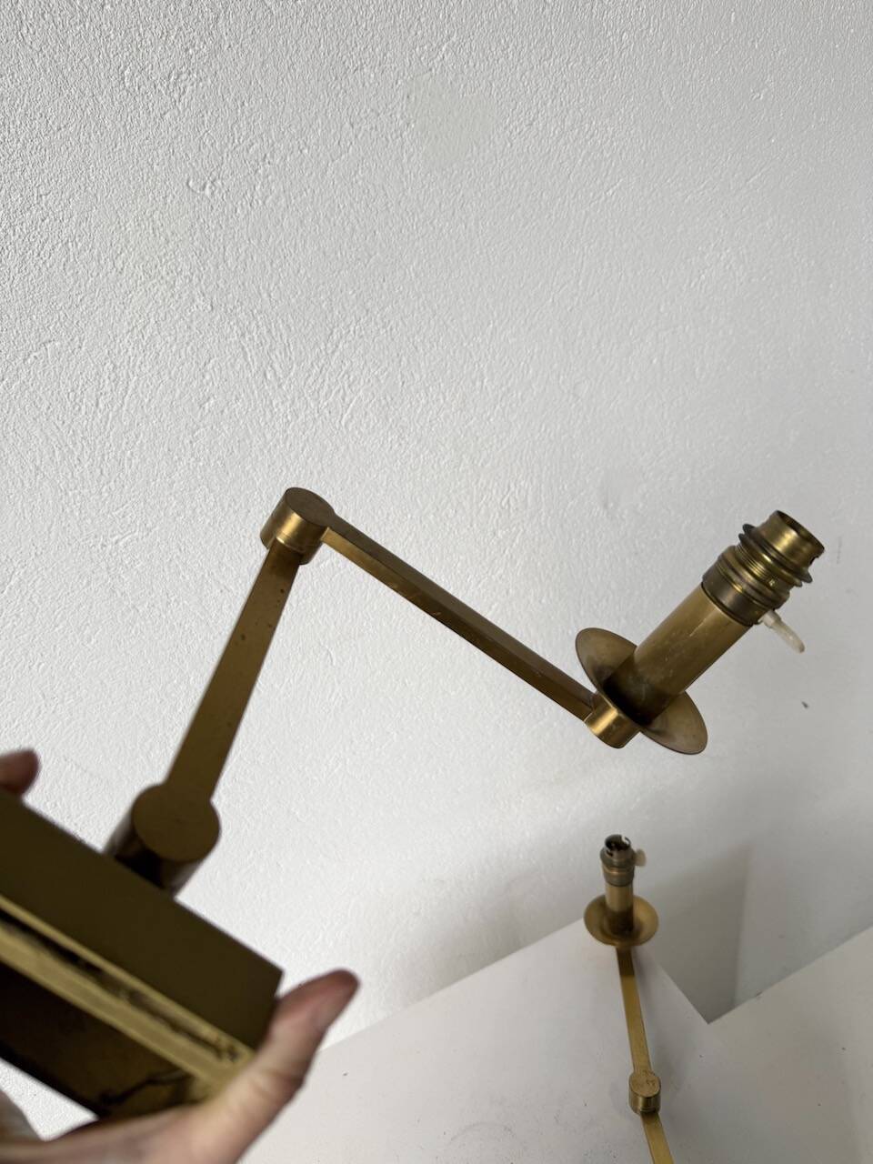 Pair of brass wall lights with articulated arms from the 70s