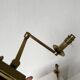 Pair of brass wall lights with articulated arms from the 70s