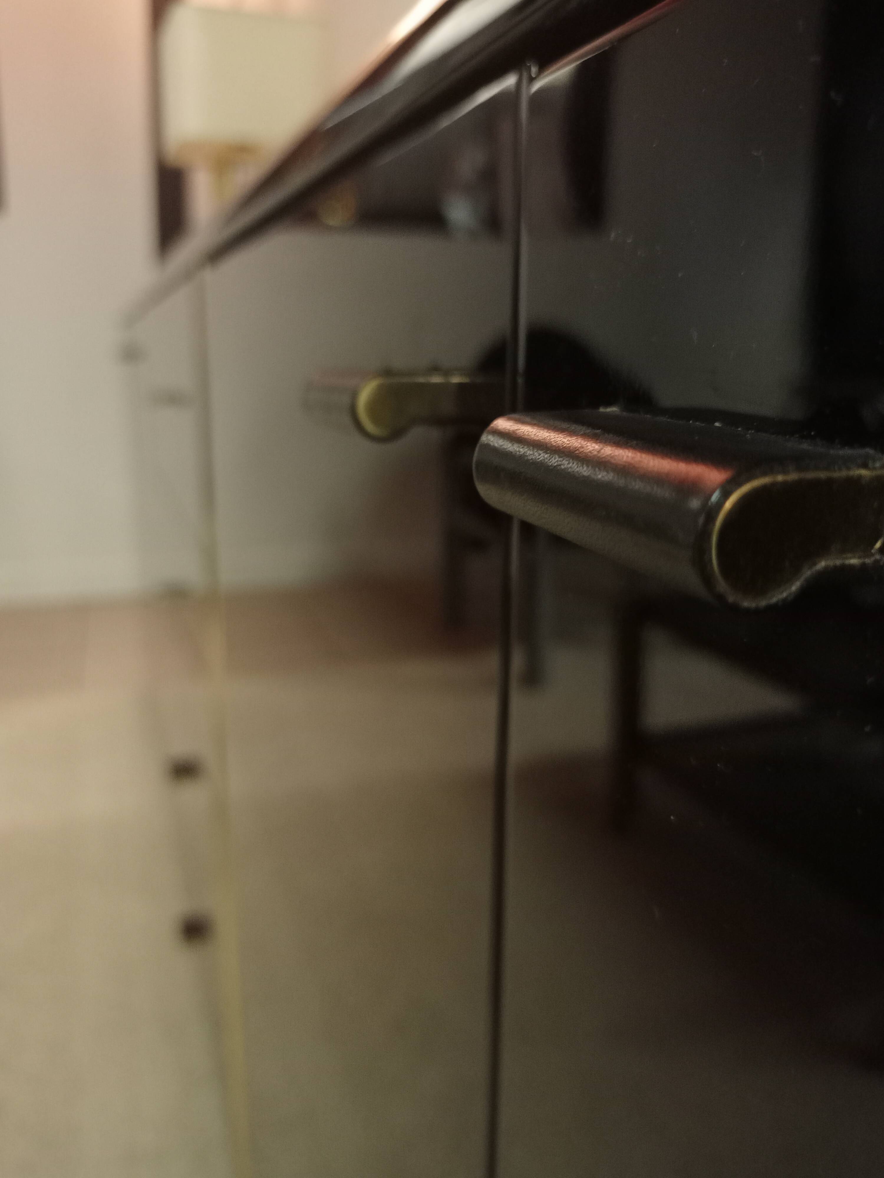 Black lacquered and brass design 70/80