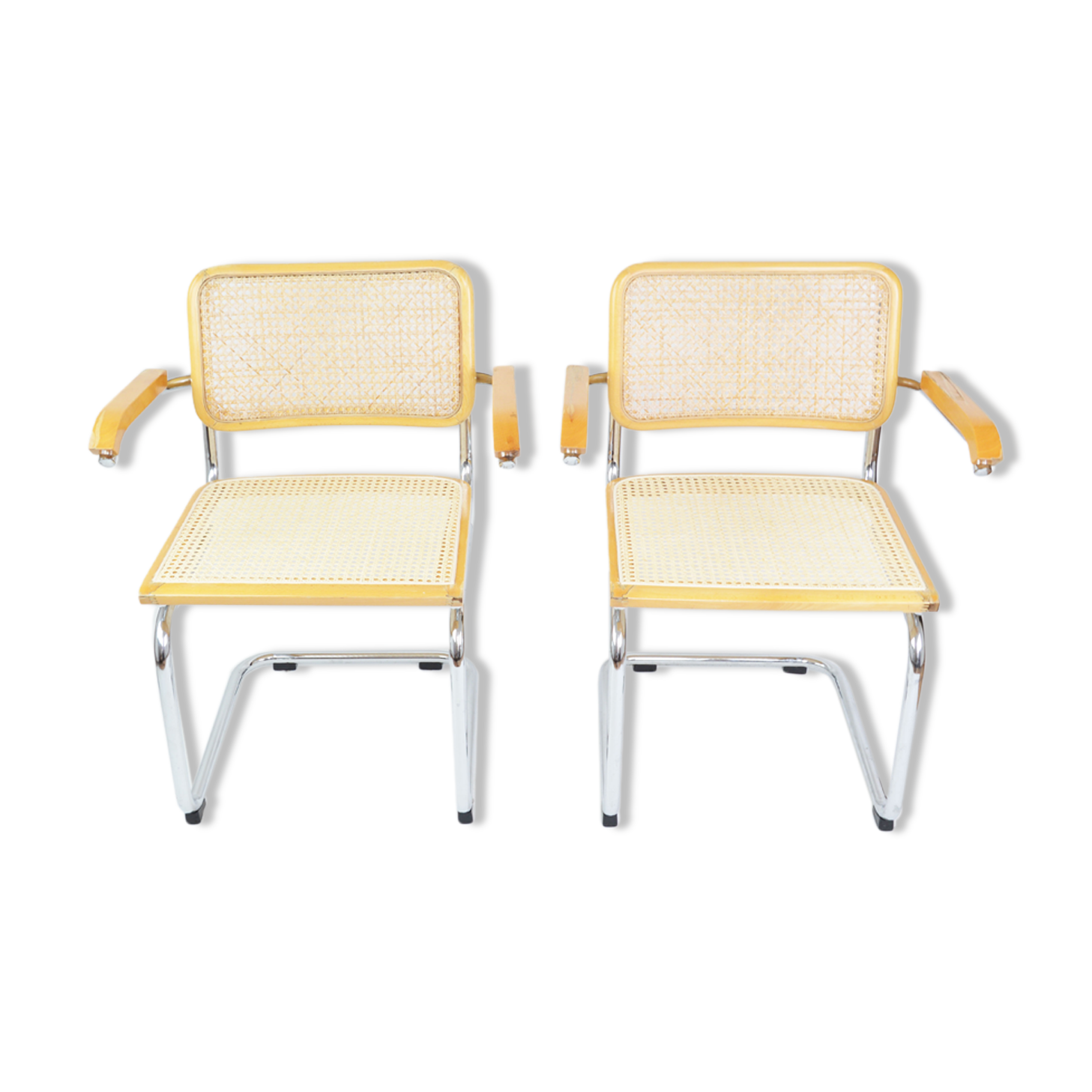 A pair of chairs with armrests, 1970s