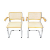 A pair of chairs with armrests, 1970s