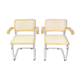 A pair of chairs with armrests, 1970s