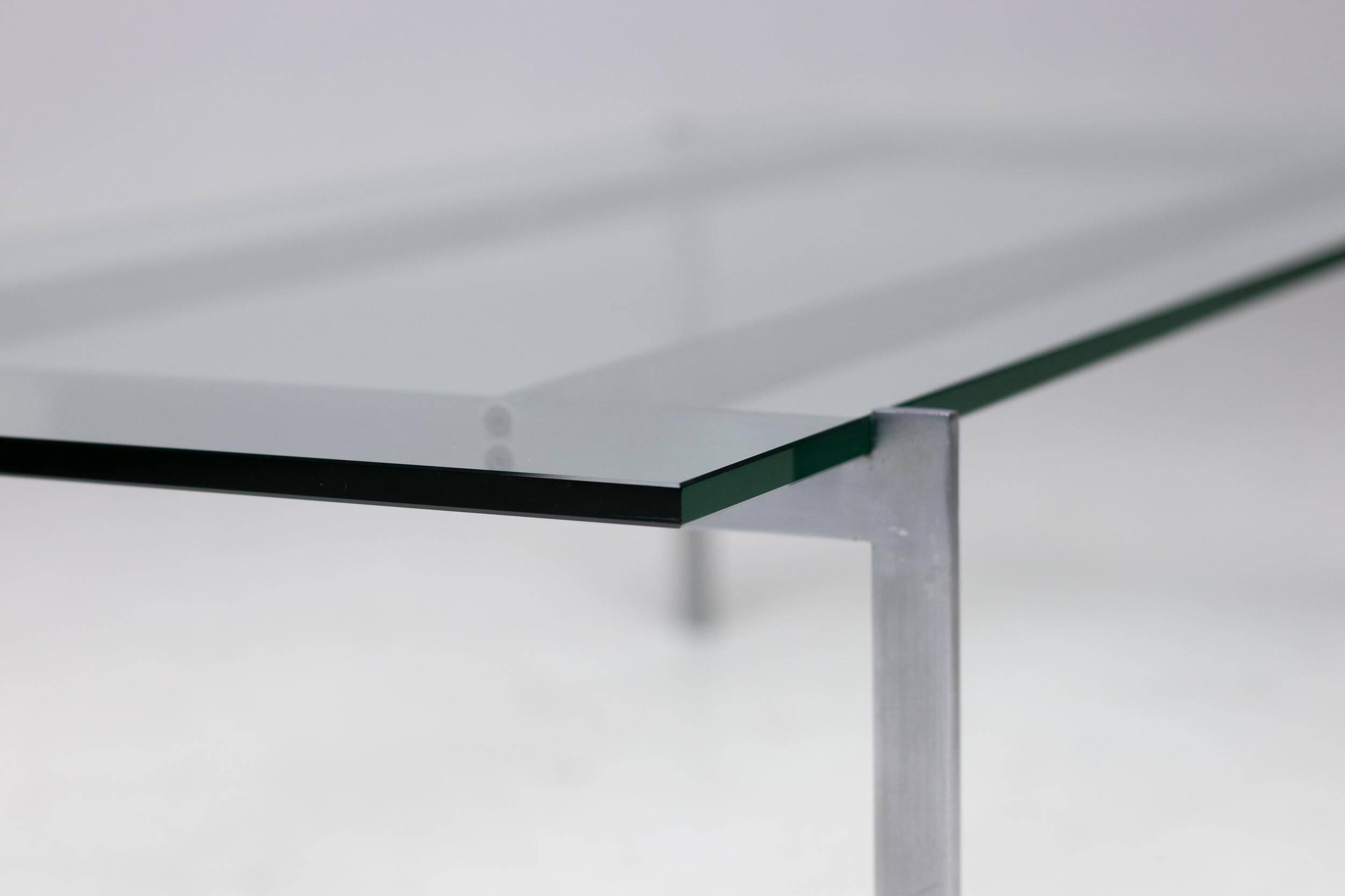 Architectural rectangular coffee table in steel and glass.