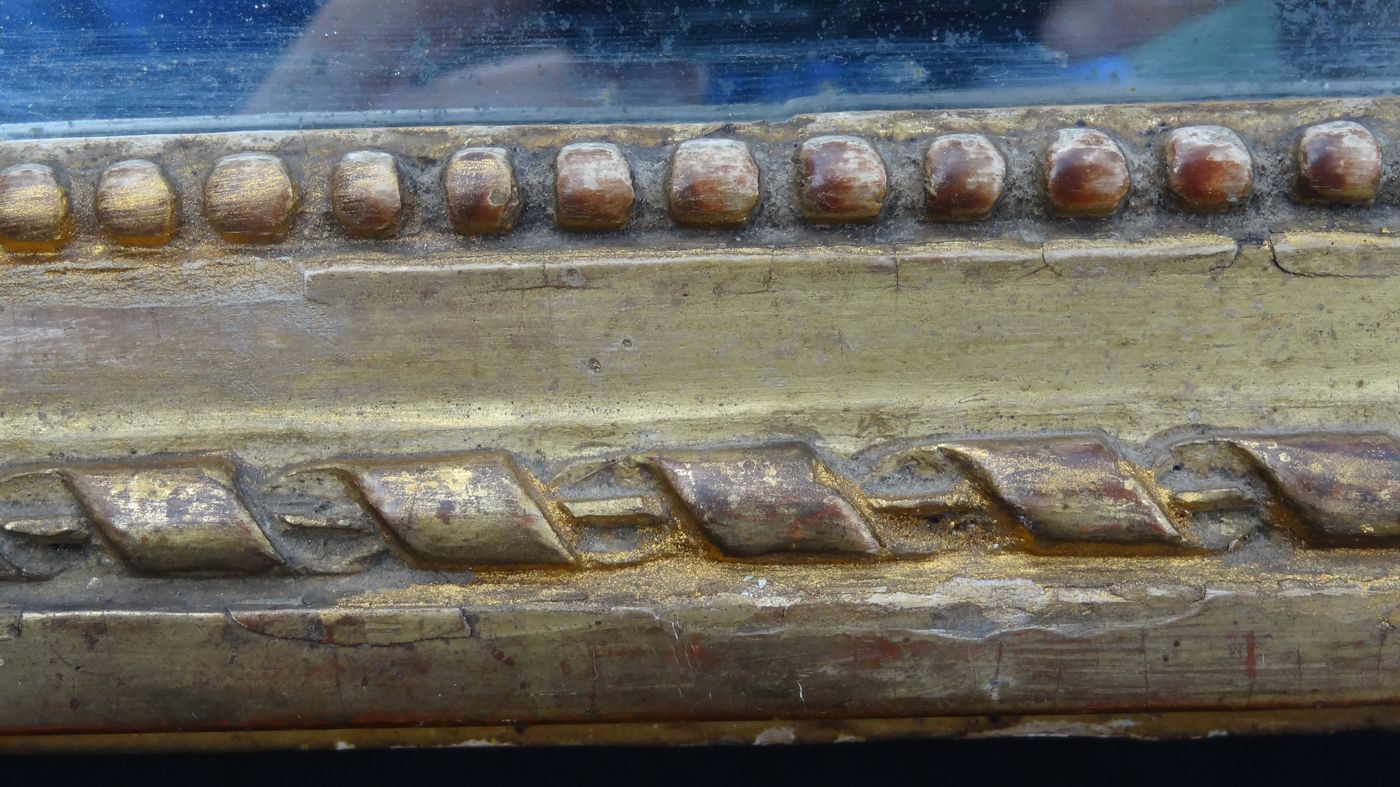 Louis XVI period mirror in gilded carved wood