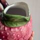 Ceramic jug in the shape of a strawberry.