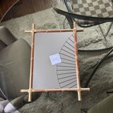 Mirror in gilded stucco, bamboo patina and gold leaf.