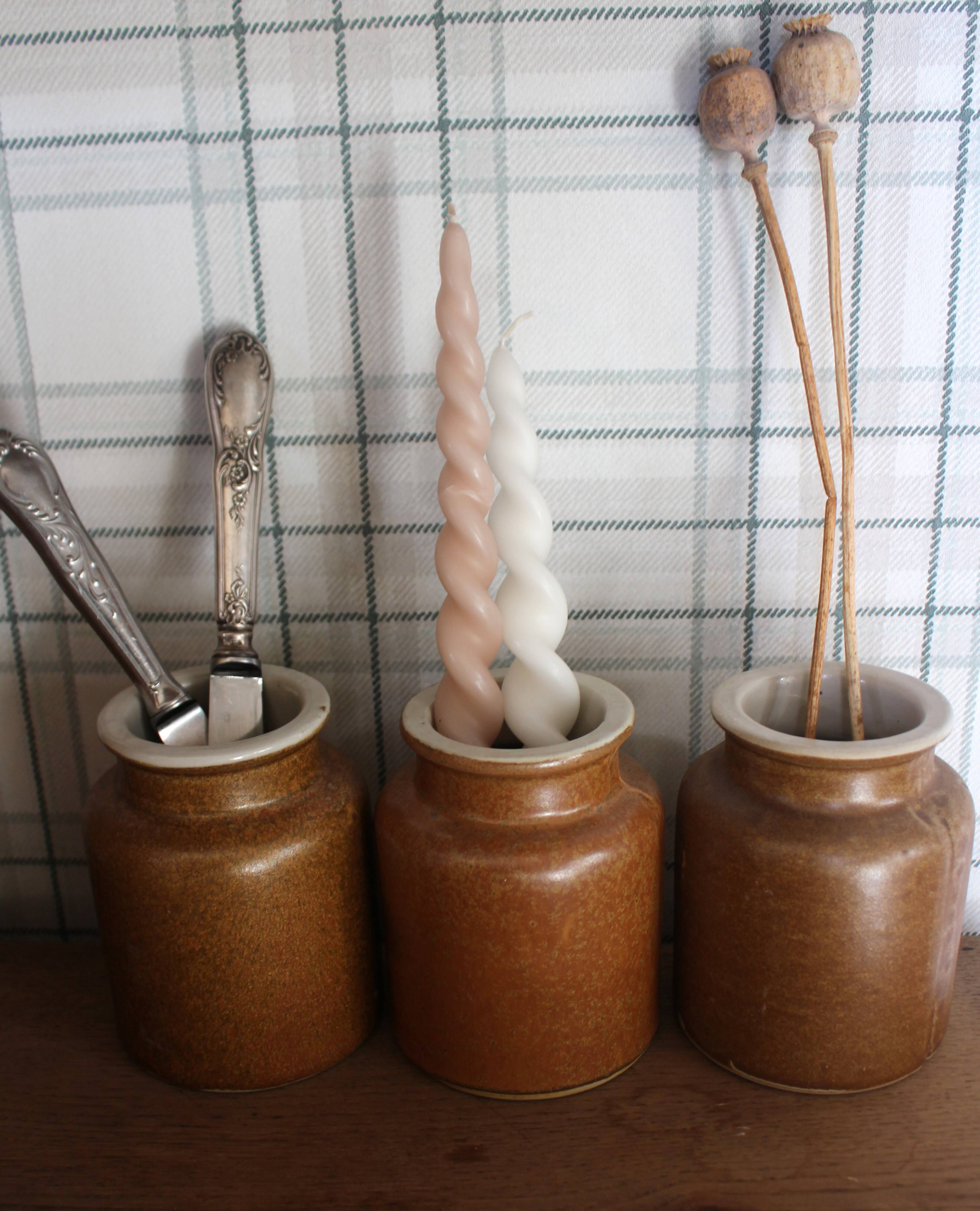 A set of 3 vintage glazed stoneware vases for indoor use.