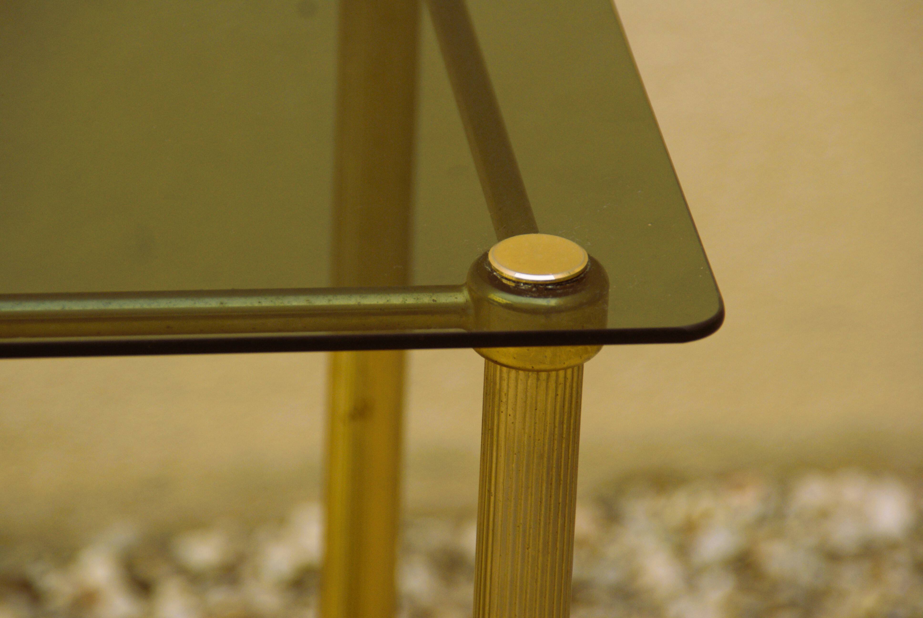 Antique brass serving trolley with smoked glass top, Louis XVI style.