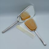 Ensemble Miroir à main, peigne et brosse.