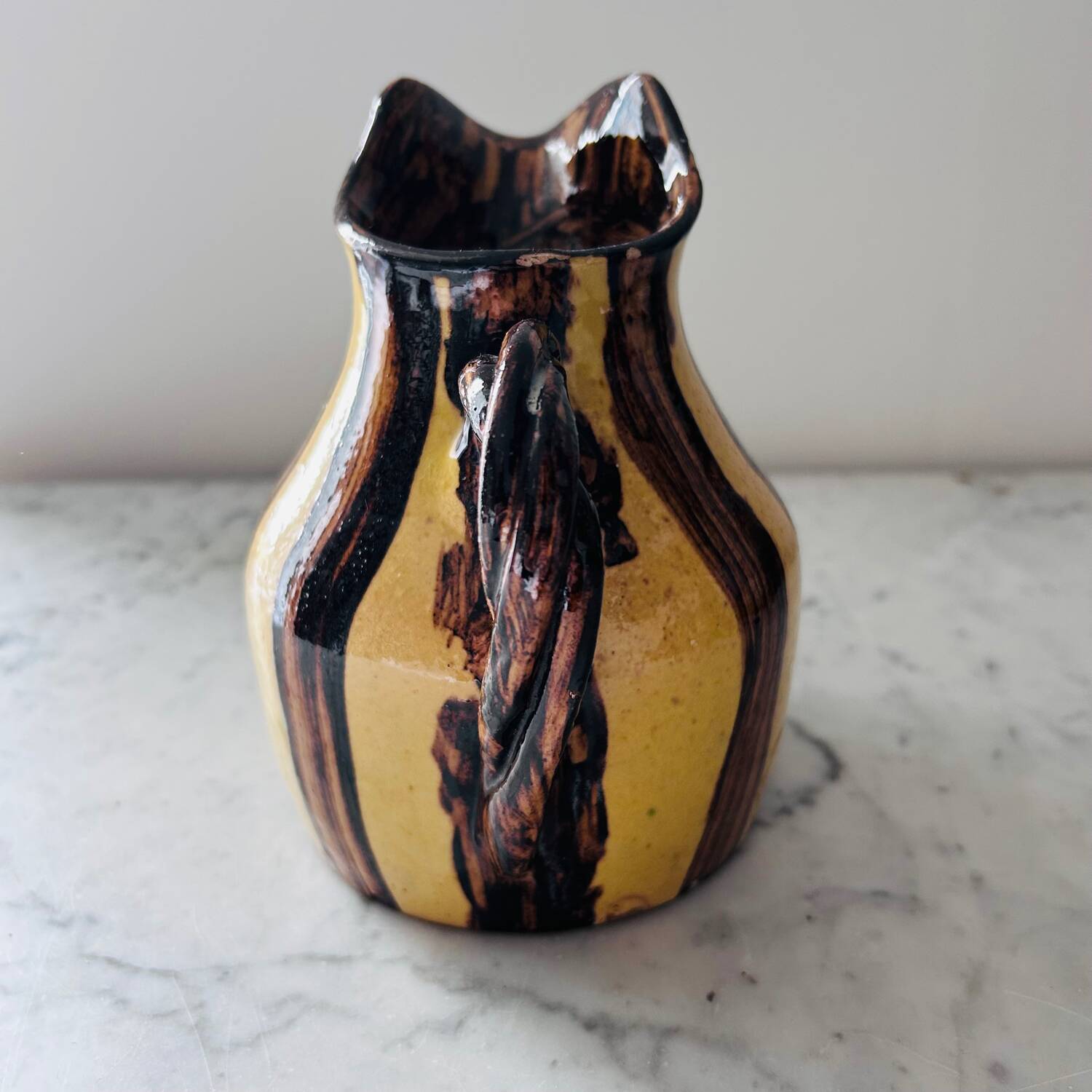Striped decorative pitcher signed
