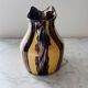 Striped decorative pitcher signed