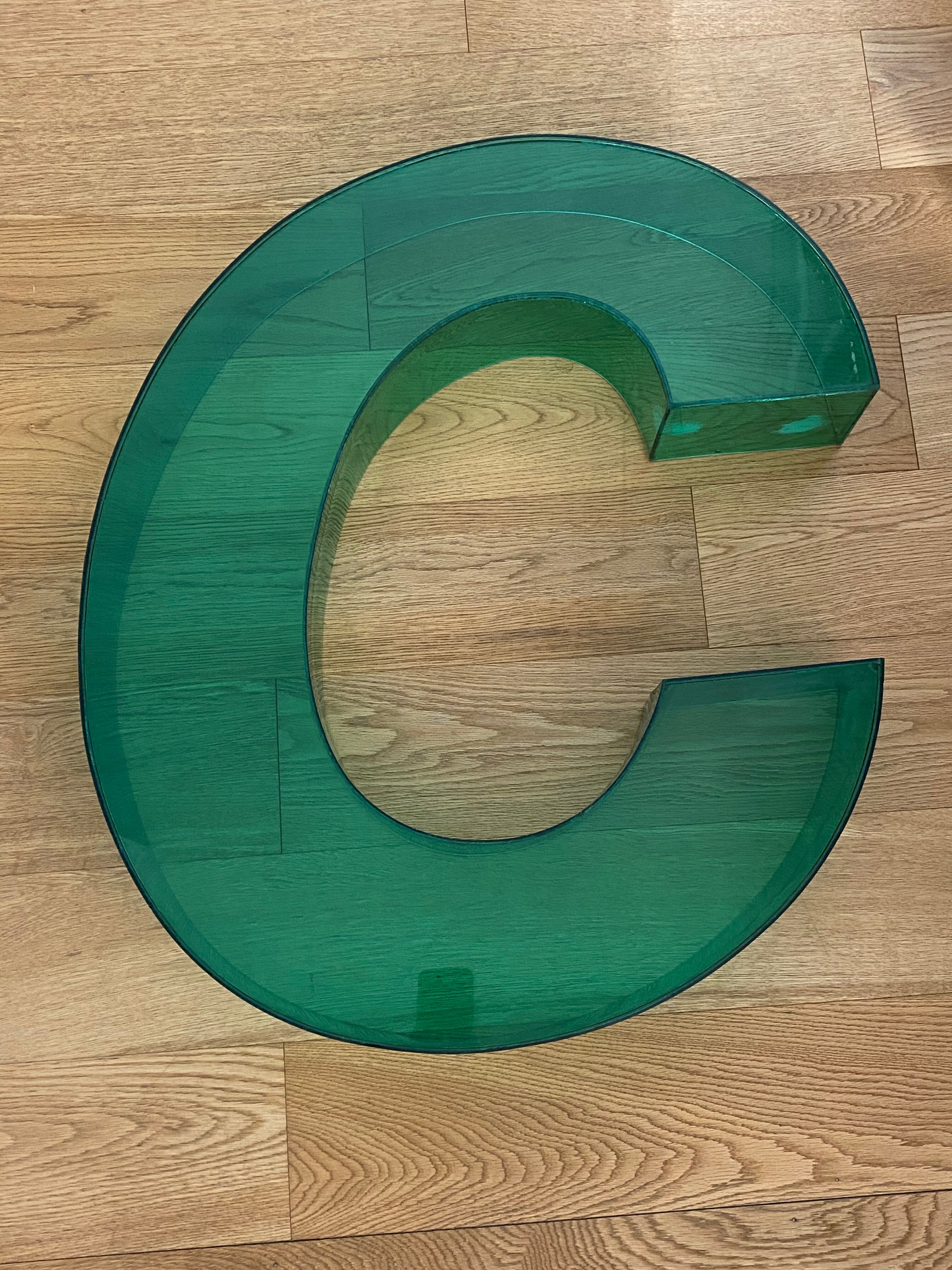 Letter signs C in transparent plexiglass