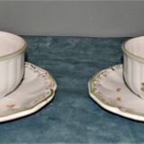 Two MOUSTIER cups decorated with flowers signed