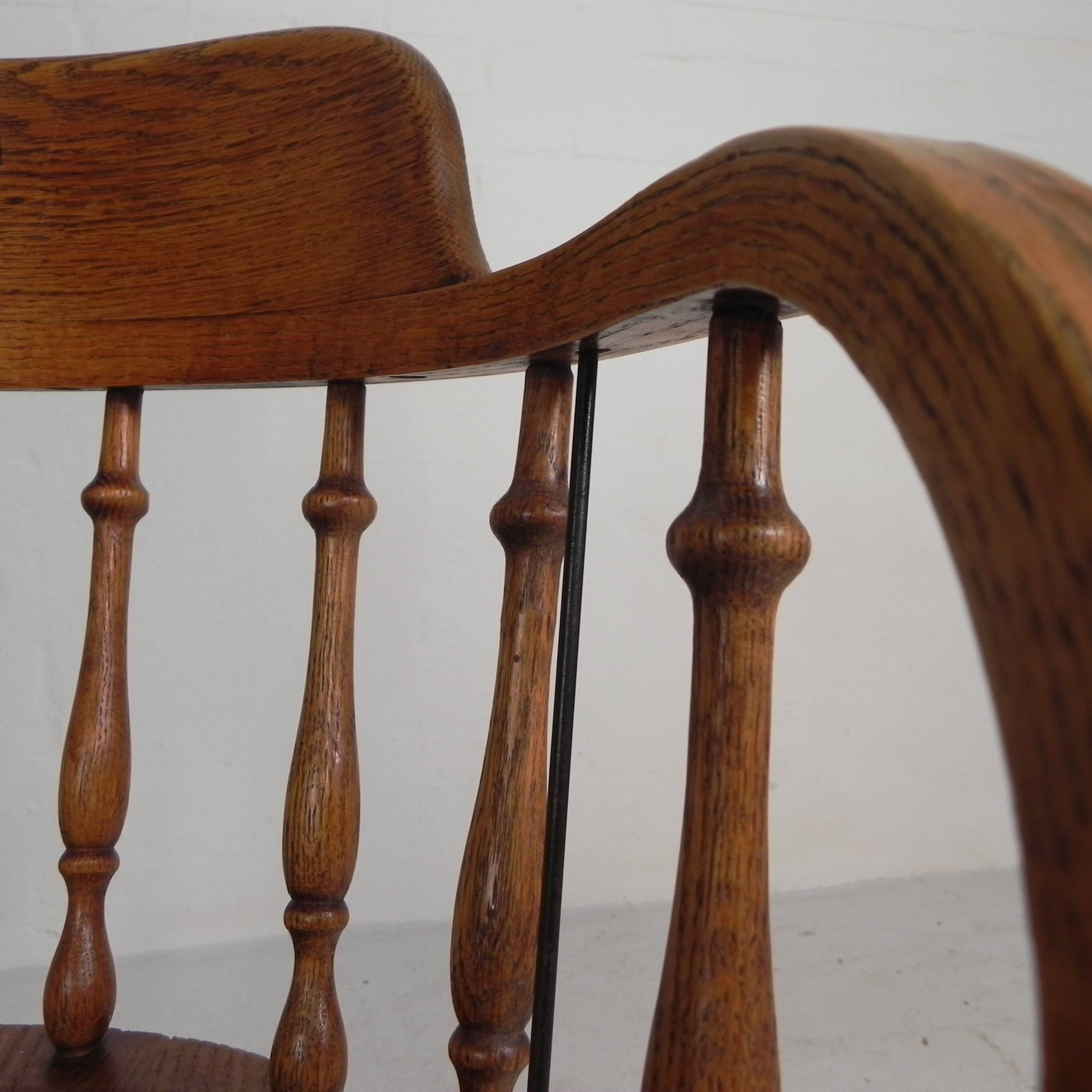 Oak office chair with a spring system and height adjustable, 1930s.