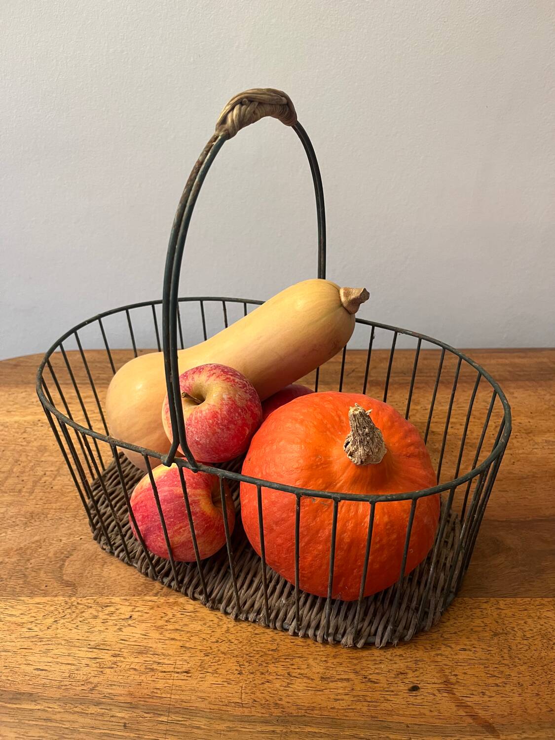 Small wicker and green metal basket