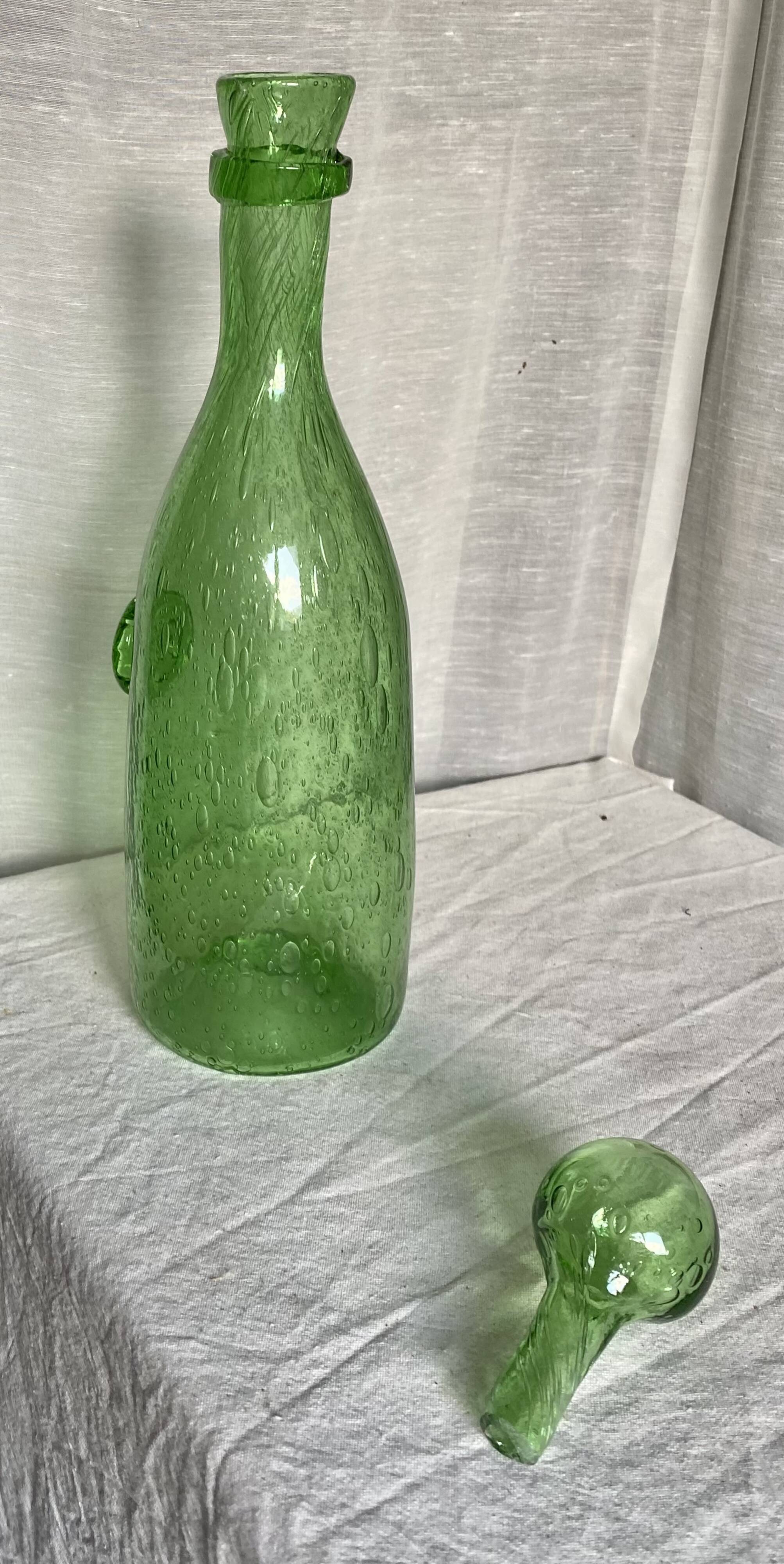 Biot-signed bubble glass bottle, green carafe