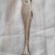 Antique silver-plated sugar tongs with lion's paws.