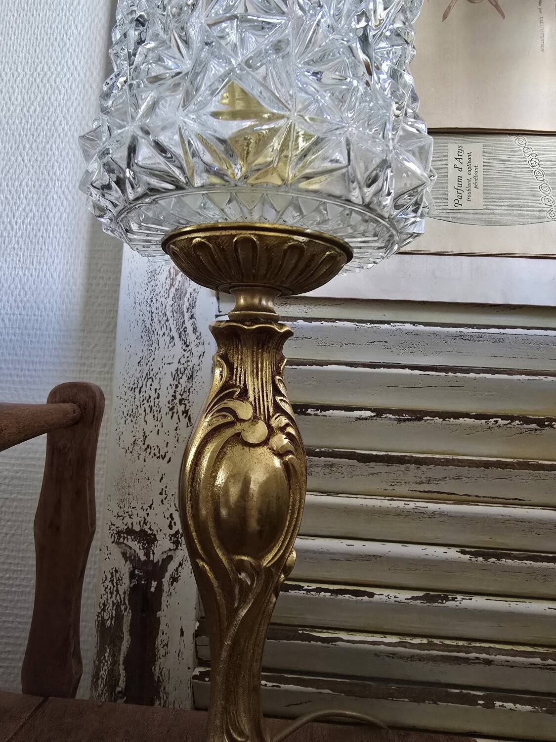 Vintage table lamp with a bronze base and moulded glass globe.