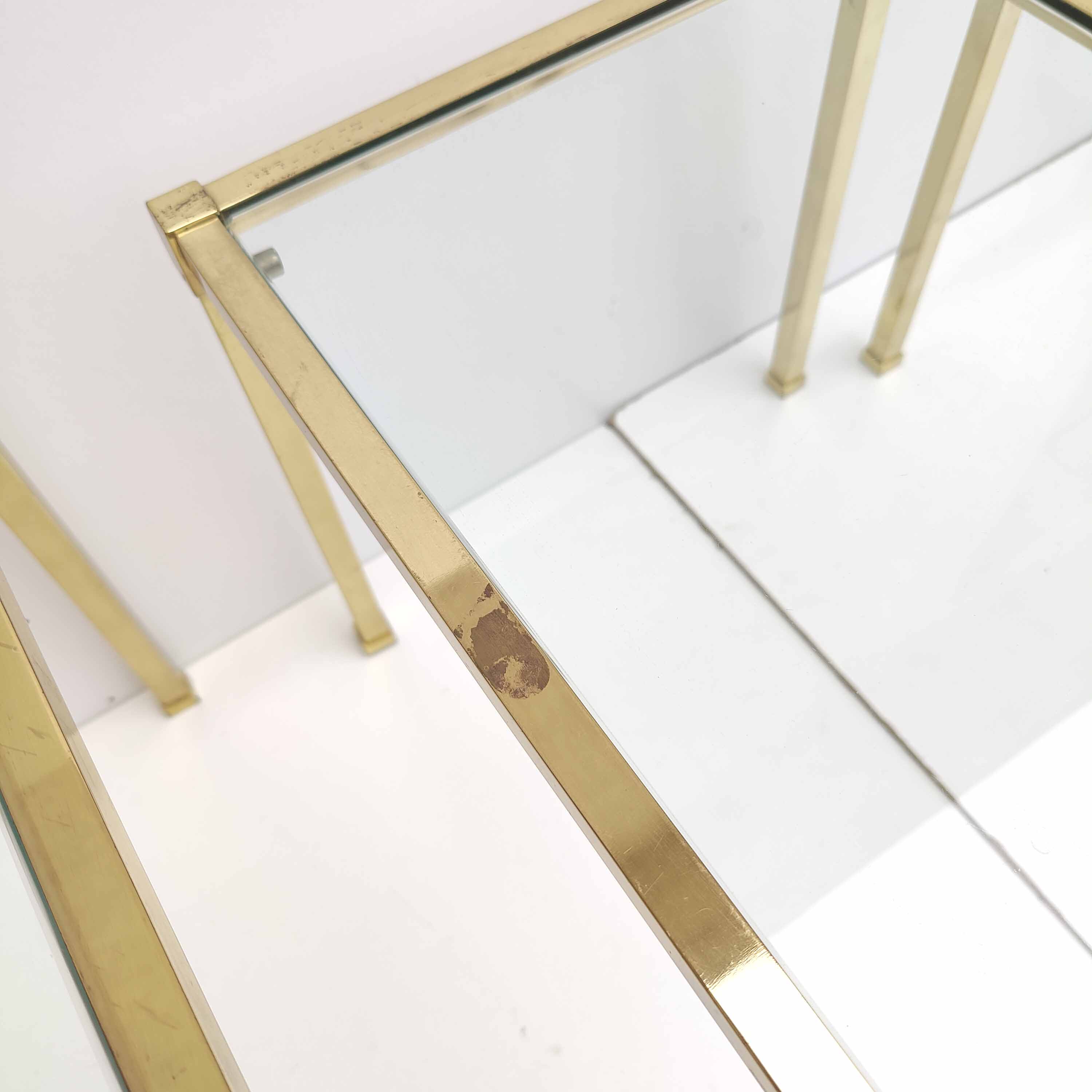 Brass and glass trundle tables