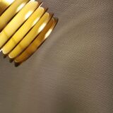 Hanging lamp in gold-colored aluminum with many layers of shades.