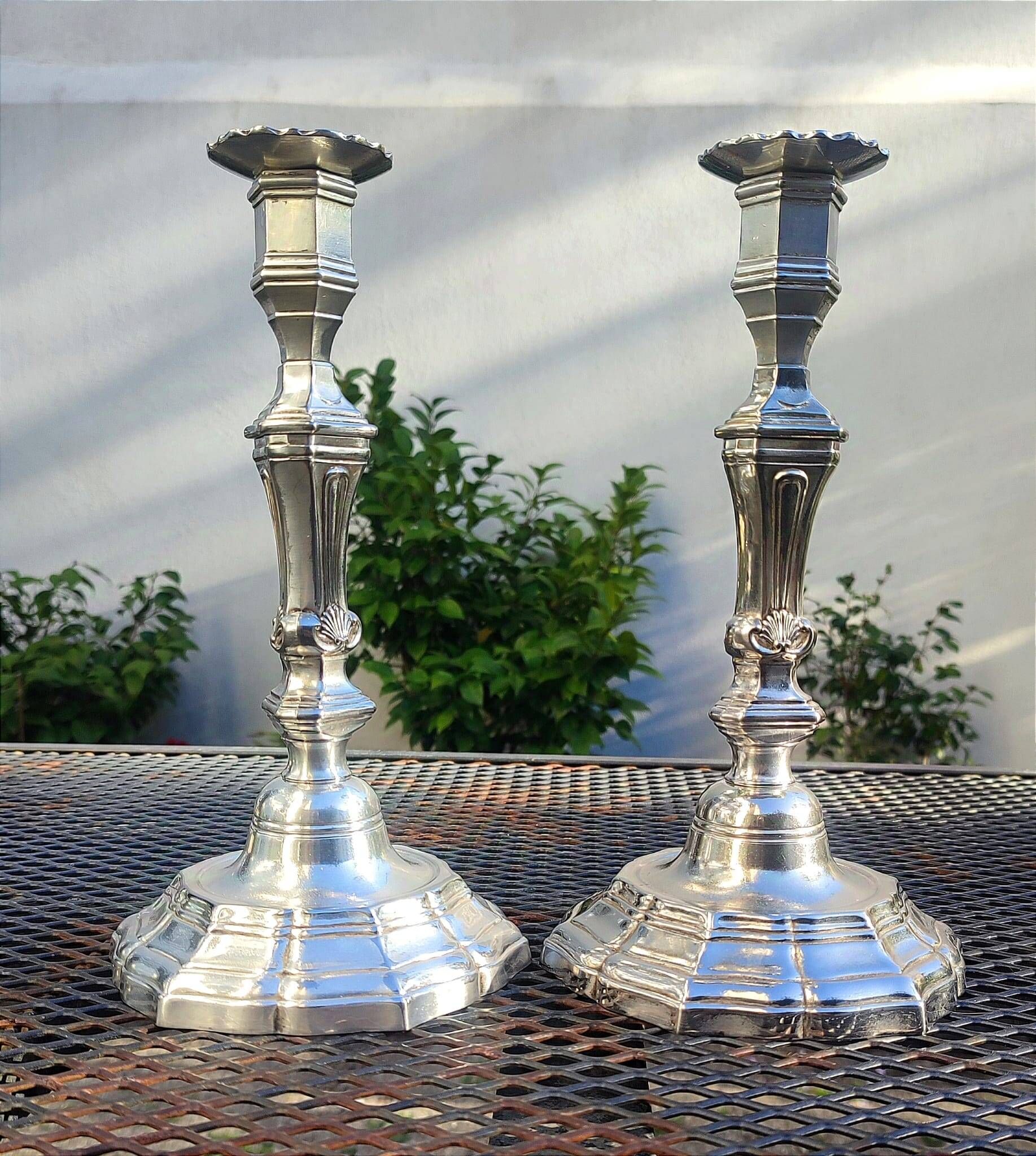 Magnificent pair of silver candlesticks.