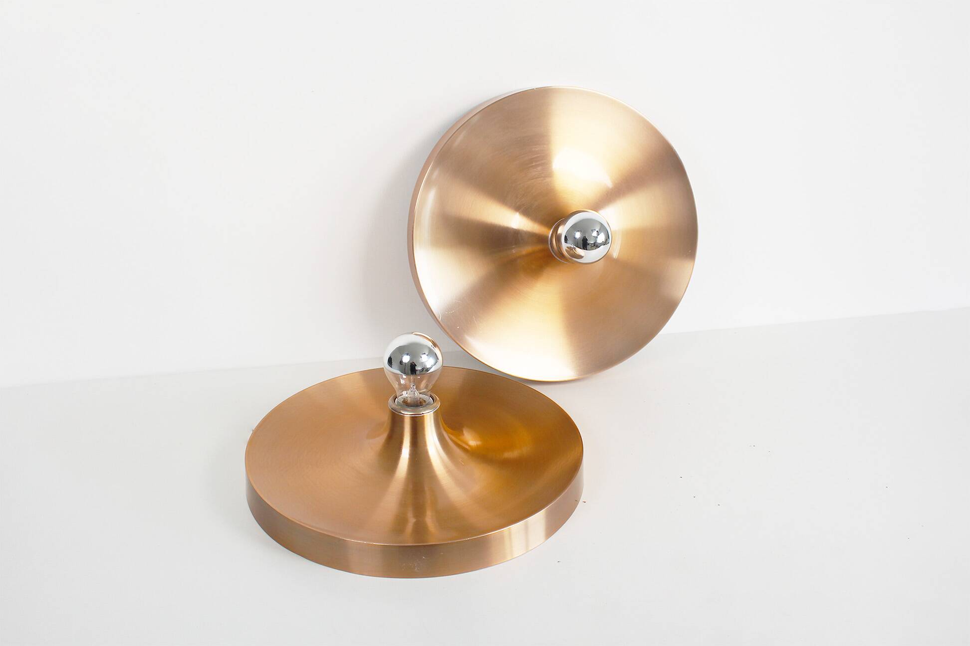 Pair of medium sized (35cm) rose gold Honsel Disc sconces selected by Charl