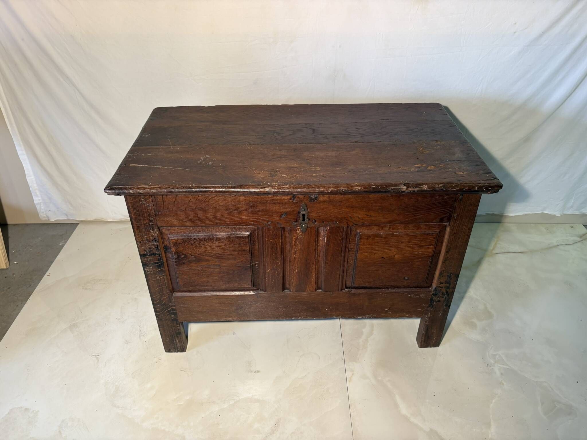Rustic antique oak chest, original fittings and moulded panels.