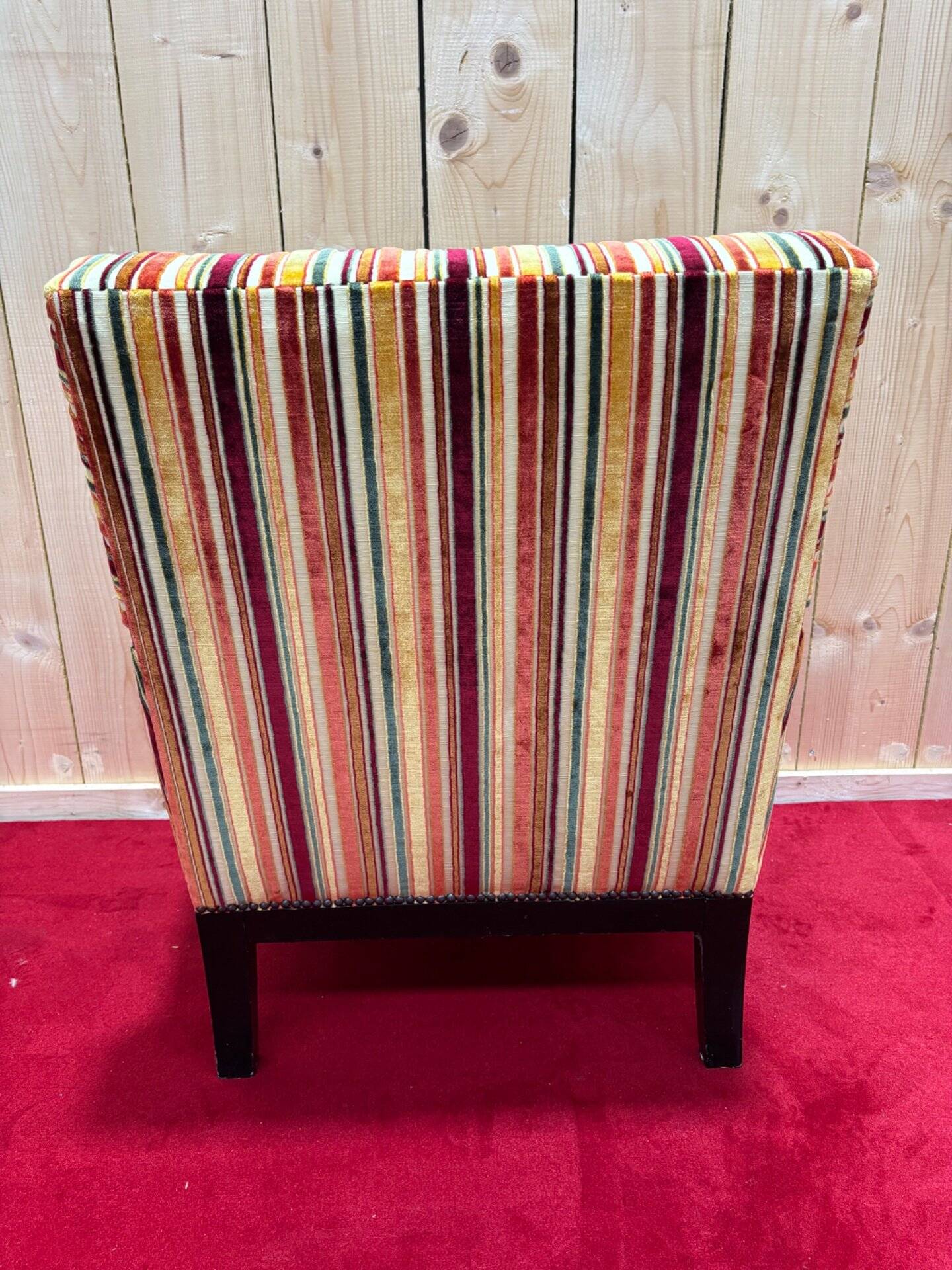 Art Deco armchair in multicolored striped fabric and its footrest